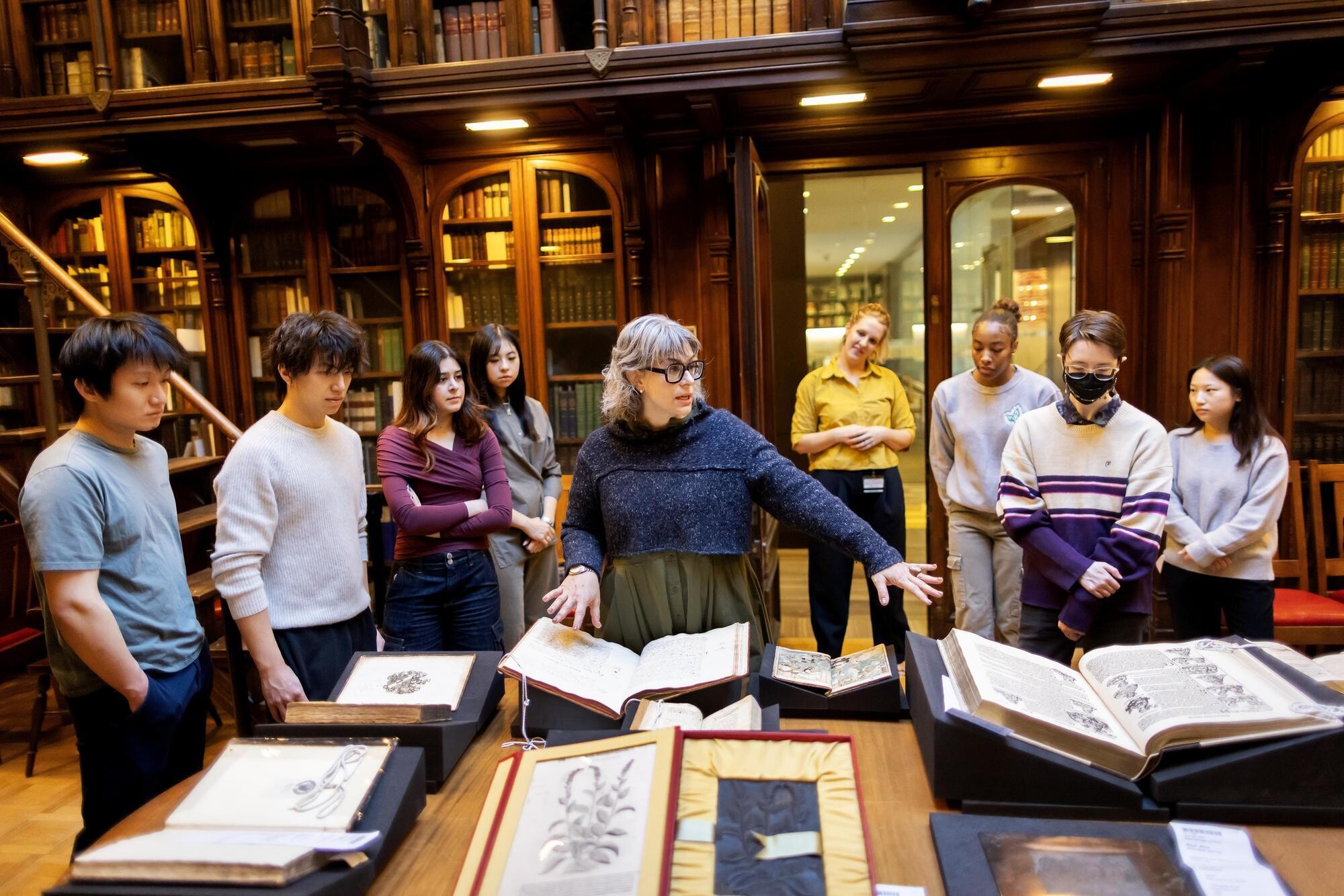 An instructor shows students a variety of materials in the Lea Library