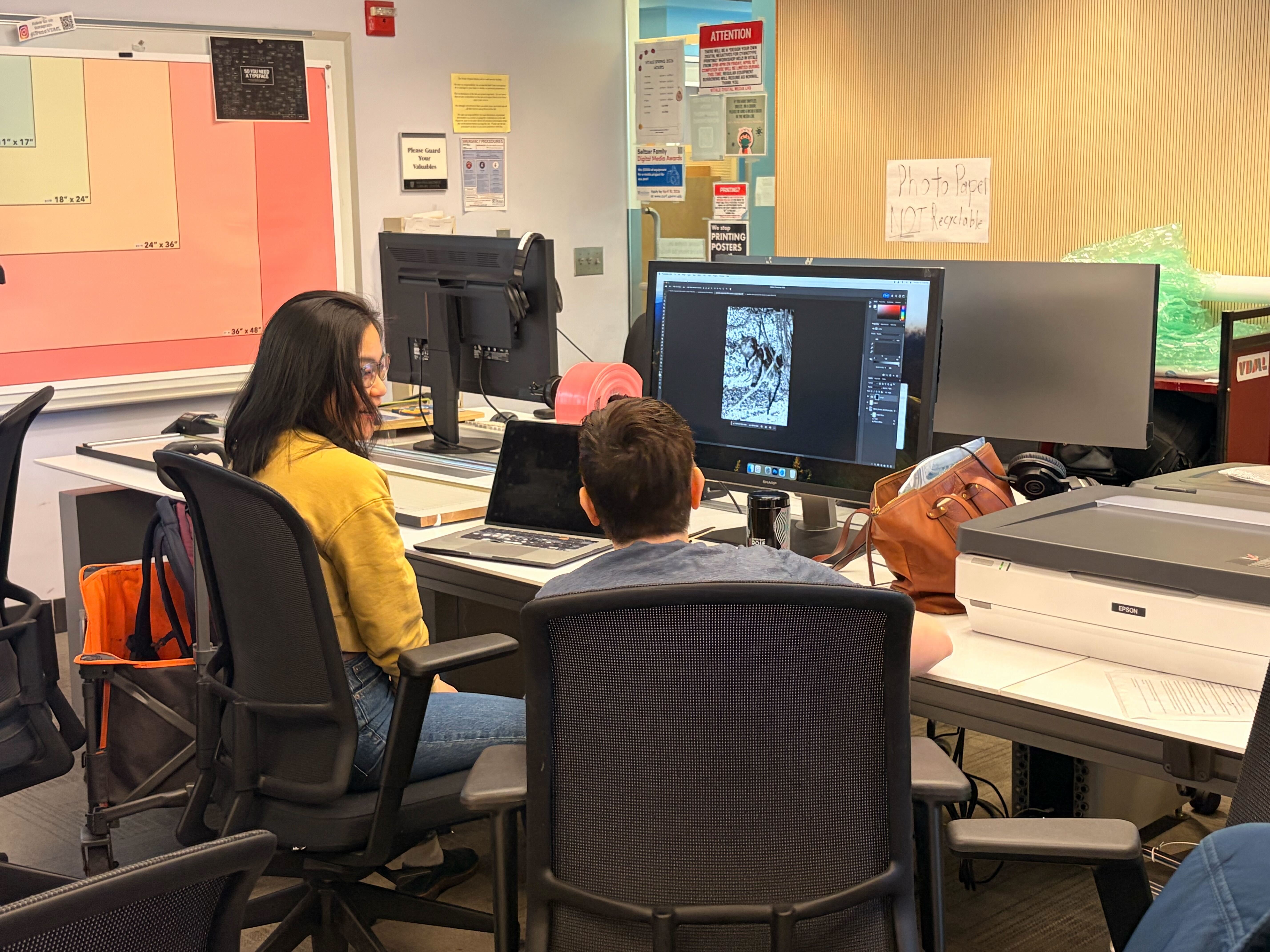 2 people at a computer during a Cyanotype workshop.