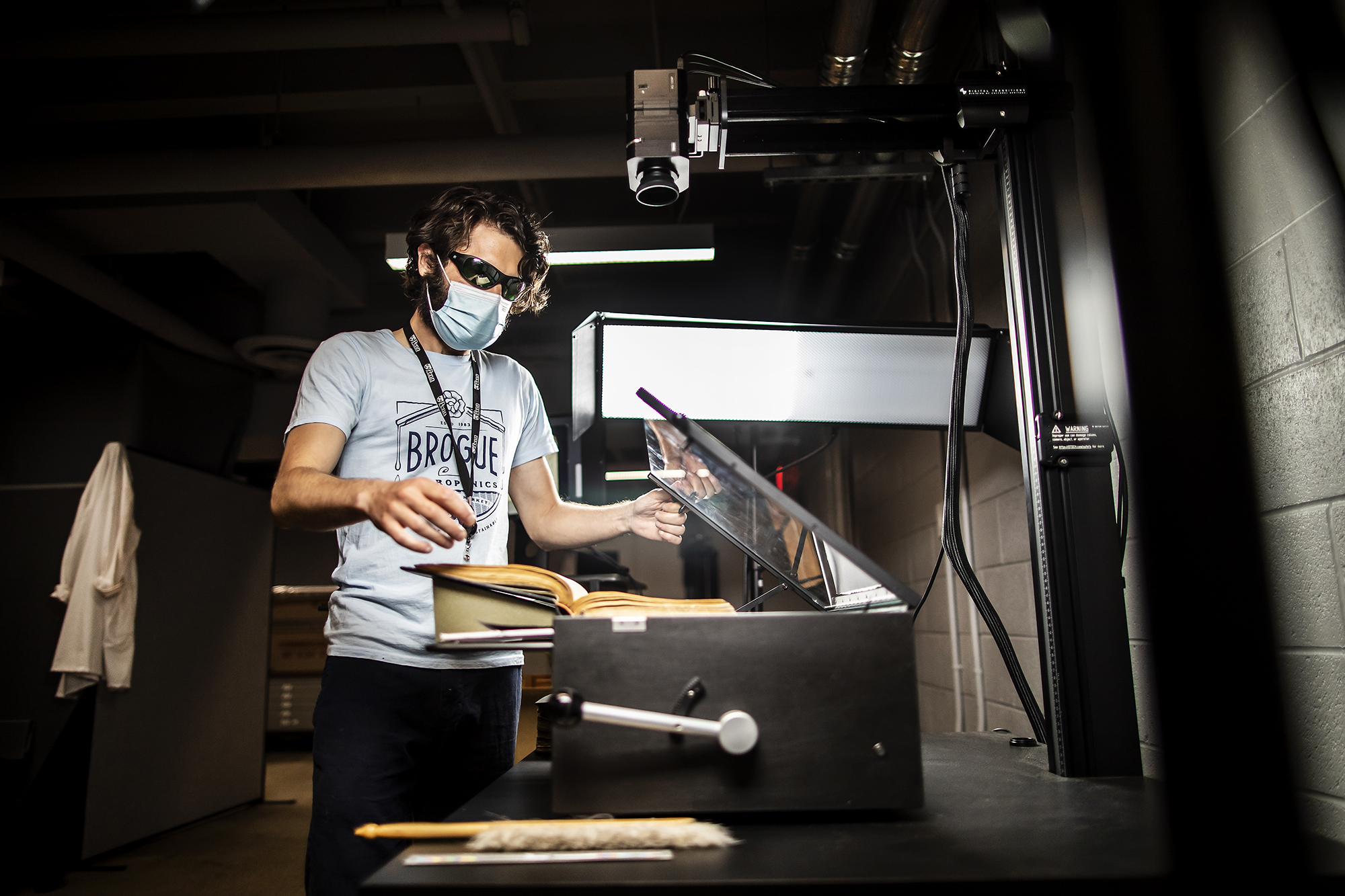 SCETI employee scanning a book